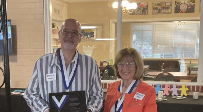 Kiwanis Club of Clermont -(L) Thom Battisto is honored with the Hixson Award (R) presented by Joan Kyle